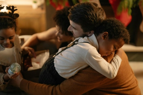 Warm family embrace, nurturing child emotional needs