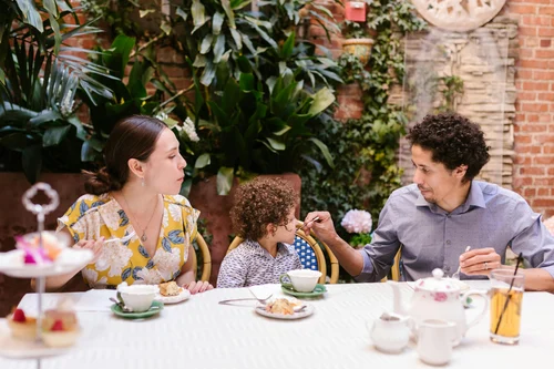 Family having outdoor afternoon tea
