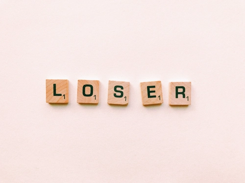 Wooden Scrabble tiles spelling 